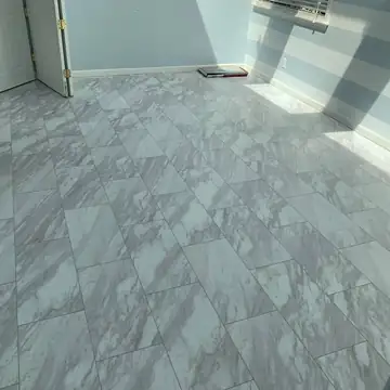 Marble-look vinyl tile flooring installed by Hudson Valley Carpets