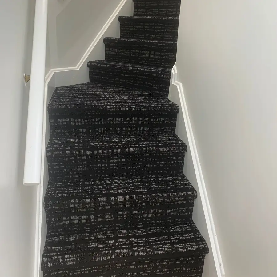 Black and white patterned carpet installed on winder stairs in a home, Rockland County NY