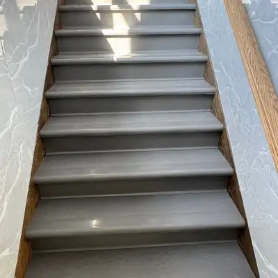 Gray rubber treads and risers on a commercial staircase