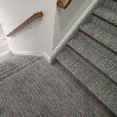 Gray carpet on stairs and landing in a home