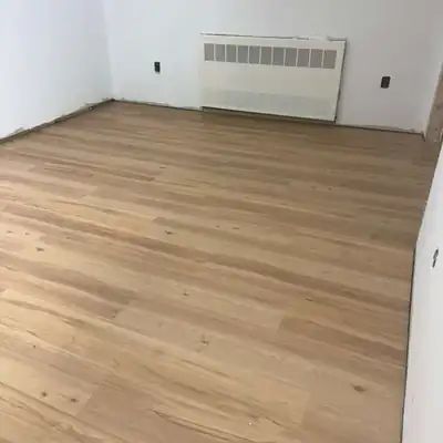Medium oak luxury vinyl plank installed in a room