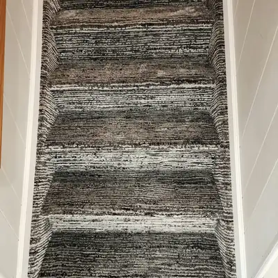 Patterned carpet installed on a staircase in a home