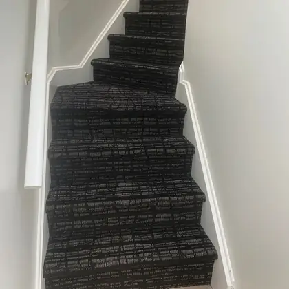 Black and white patterned carpet installed on winder stairs in a home, Rockland County NY